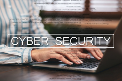 Image of Cyber security concept. Woman working with laptop at table indoors, closeup