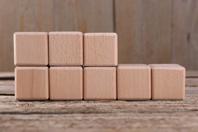 Photo of International Organization for Standardization. Cubes with abbreviation ISO 22000 on wooden table