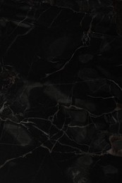 Photo of Black marble surface as background, closeup view