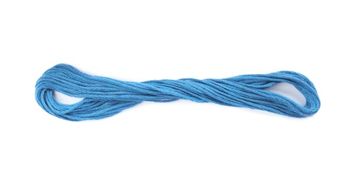 Photo of Light blue embroidery thread on white background