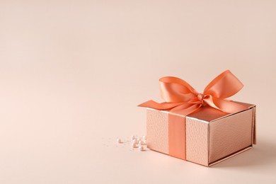 Photo of Beautiful gift box and decor on pink background, space for text