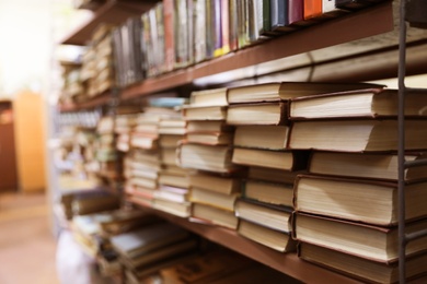 Photo of Shelving unit with collection of books in library