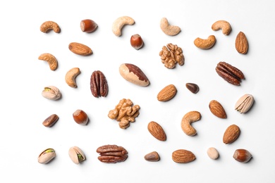 Photo of Composition with organic mixed nuts on white background, top view