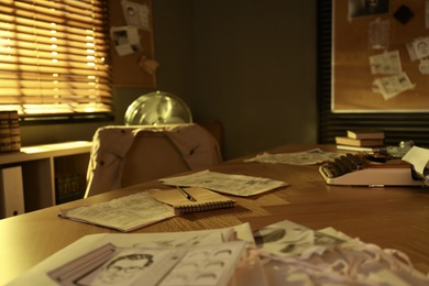 Photo of Detective workplace with vintage typewriter and documents