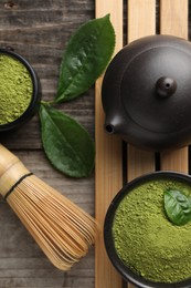 Photo of Flat lay composition with green matcha powder on wooden table