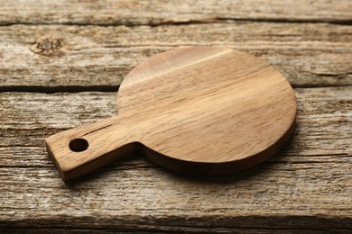 One new cutting board on old wooden table