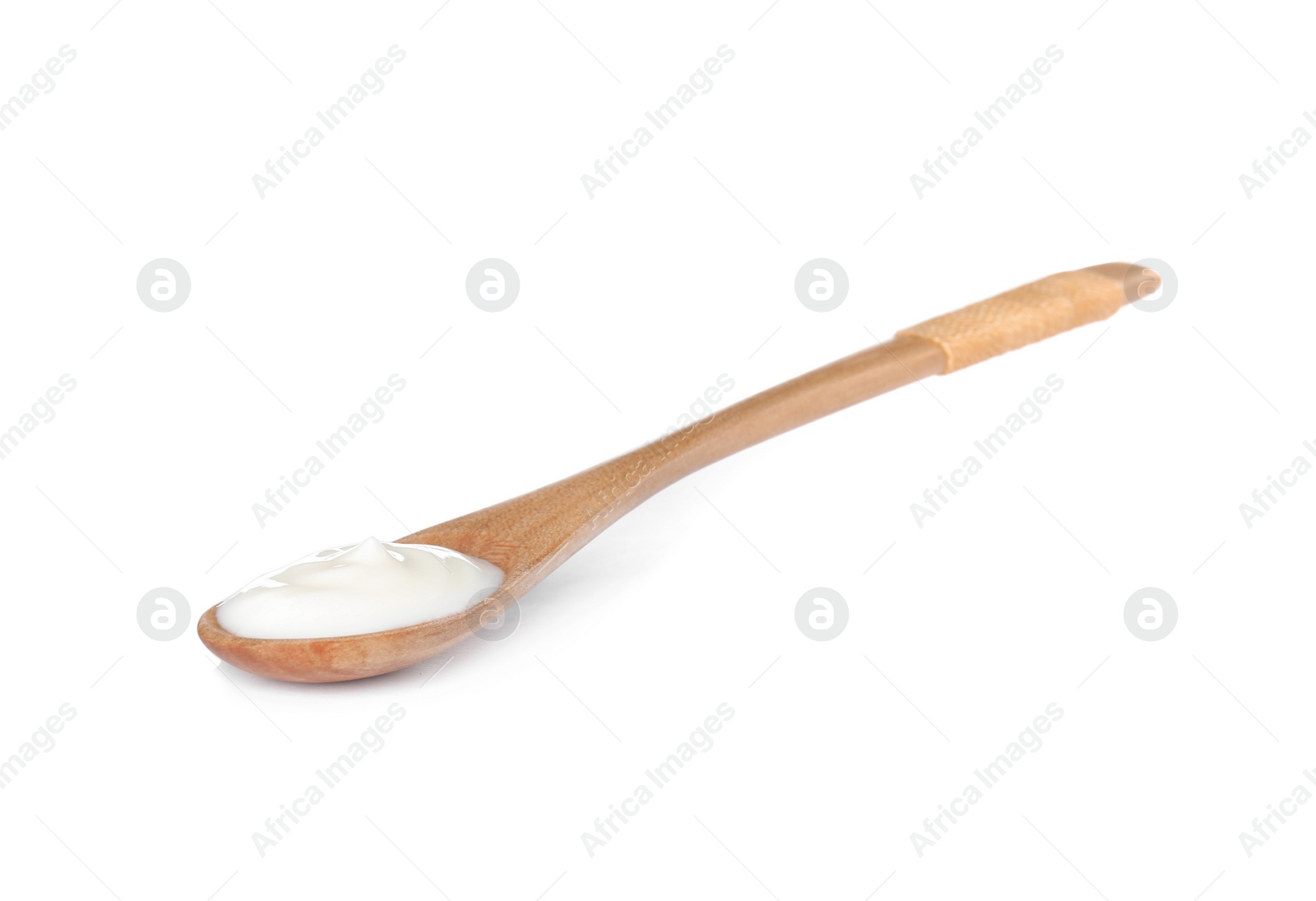 Photo of Wooden spoon with sour cream on white background