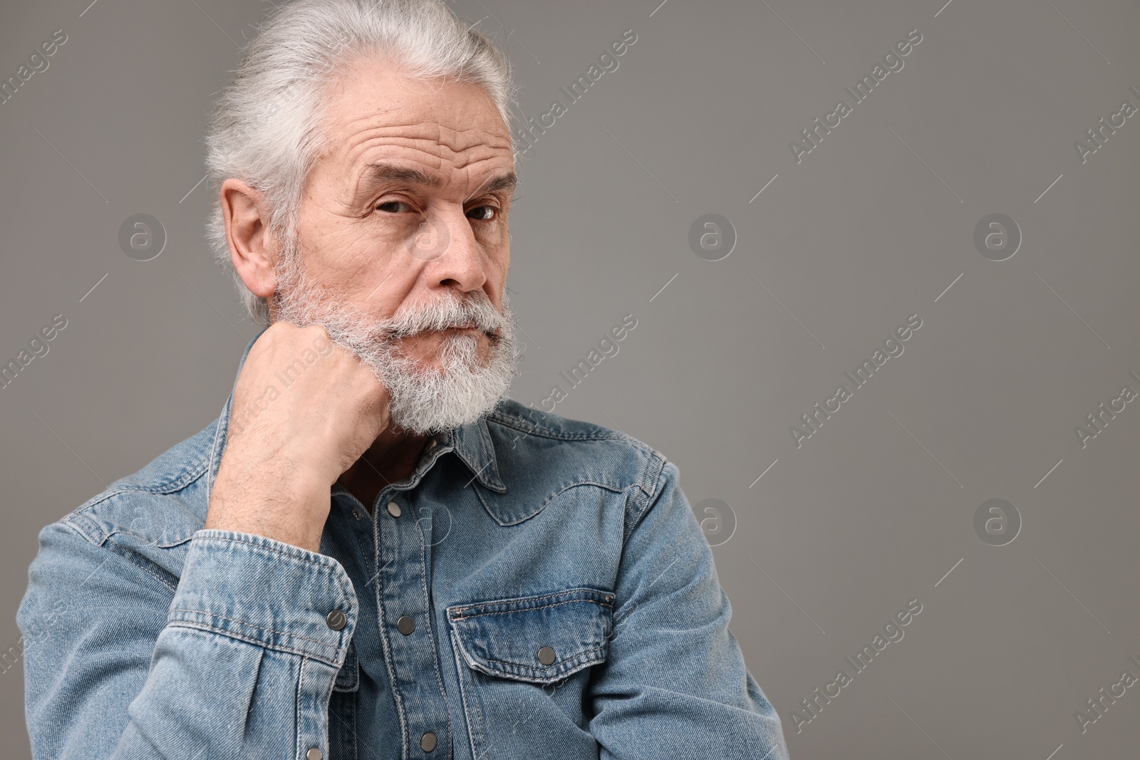 Photo of Senior man with mustache on grey background, space for text