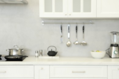 Photo of Blurred view of modern kitchen. Interior design