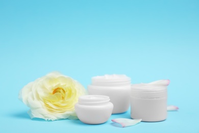 Photo of Composition with cosmetic products on color background