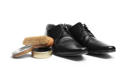Photo of Stylish men's footwear and shoe care accessories on white background