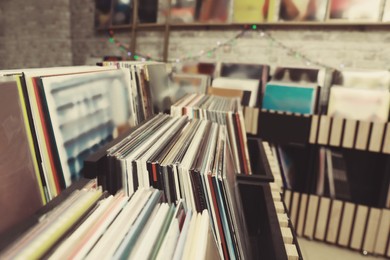 Image of Rack with different vinyl records in store