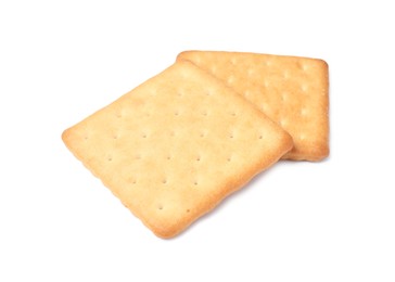 Photo of Two crispy crackers isolated on white. Delicious snack