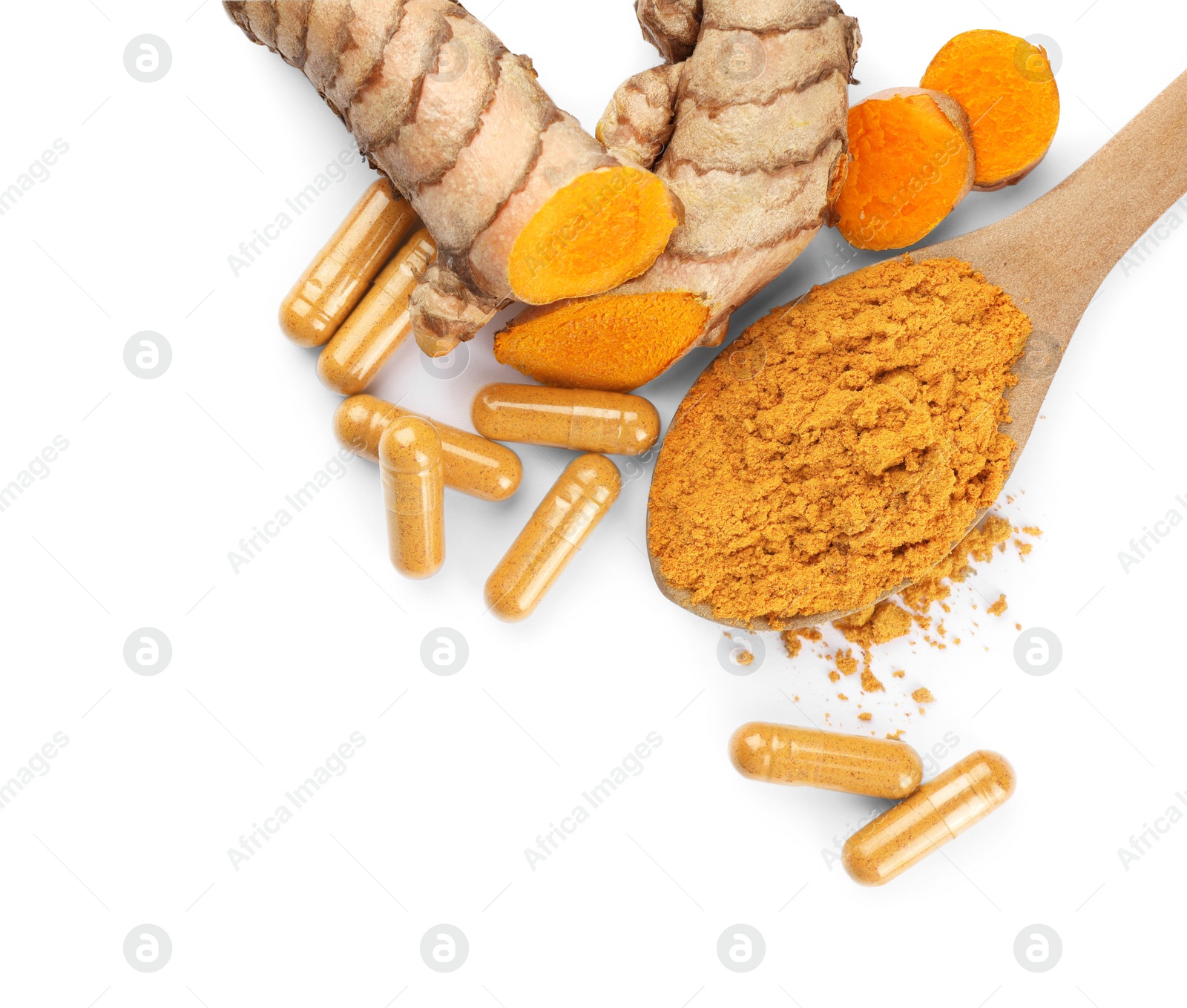 Photo of Spoon with aromatic turmeric powder, pills and raw roots isolated on white, top view