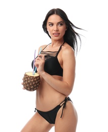 Beautiful young woman in black bikini with cocktail on white background