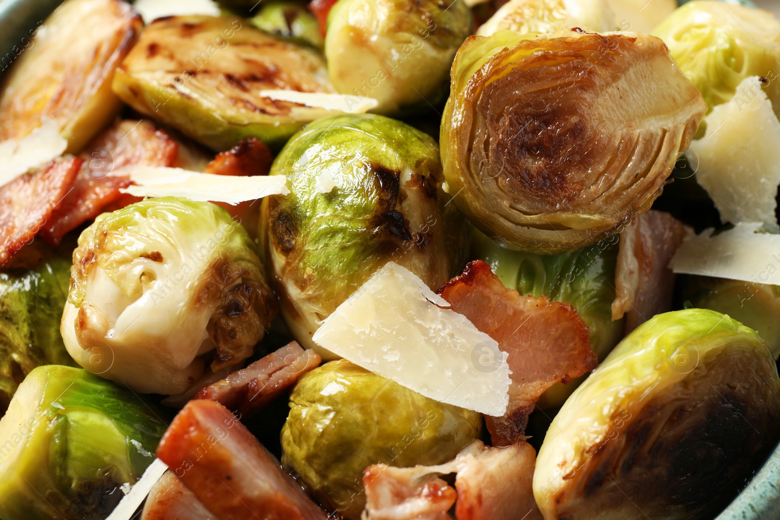 Image of Delicious fried Brussels sprouts with bacon as background, closeup