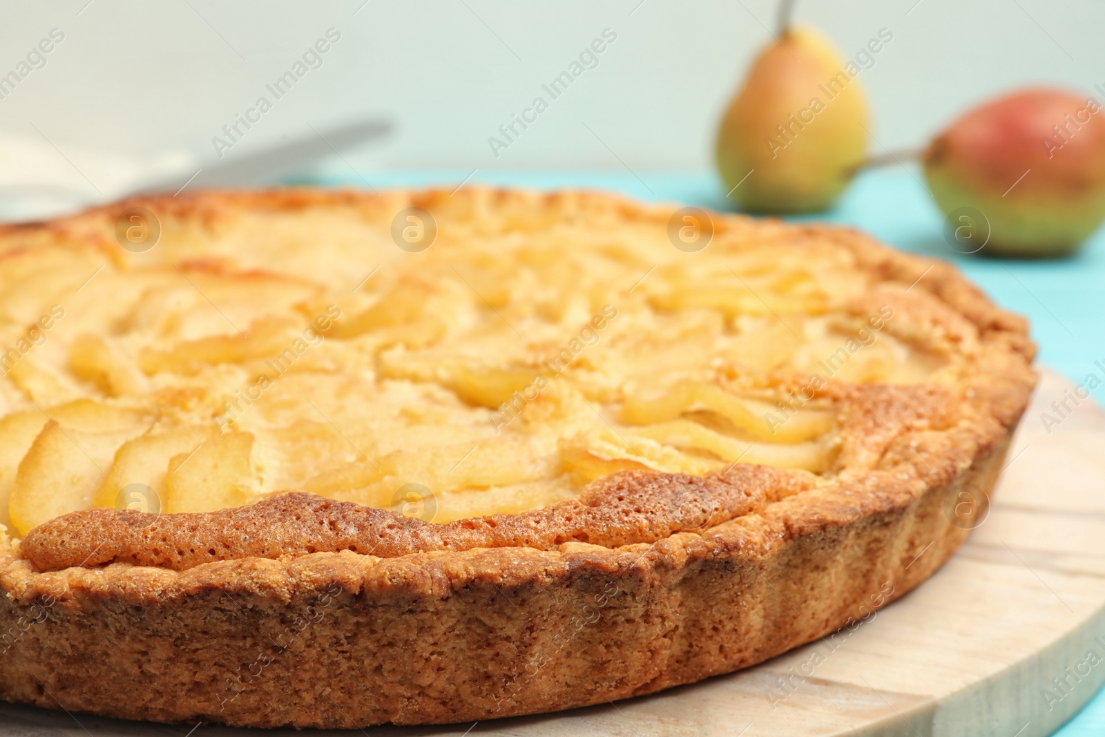 Photo of Delicious sweet pear tart on table, closeup