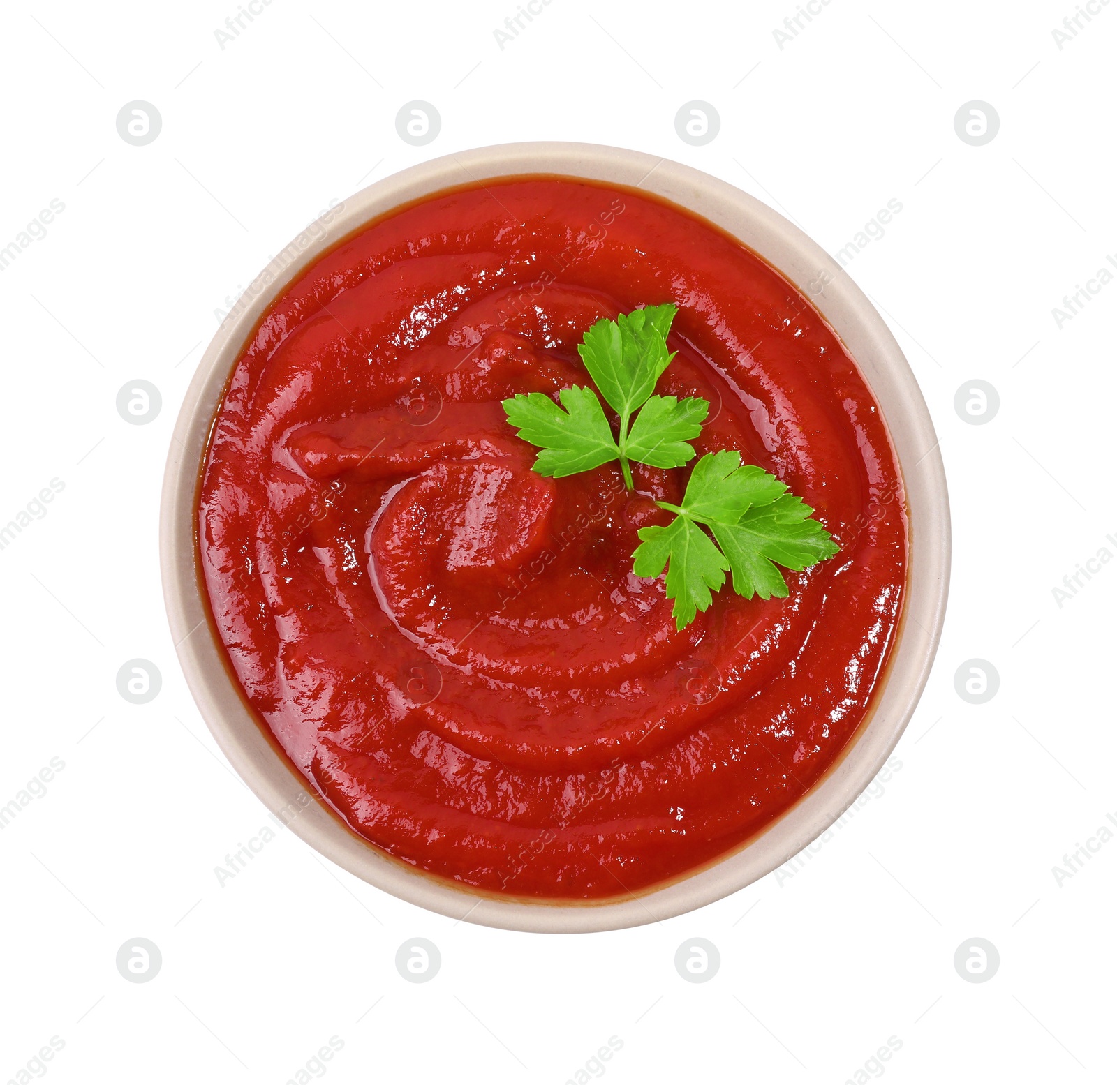 Photo of Organic ketchup and parsley in bowl isolated on white, top view. Tomato sauce