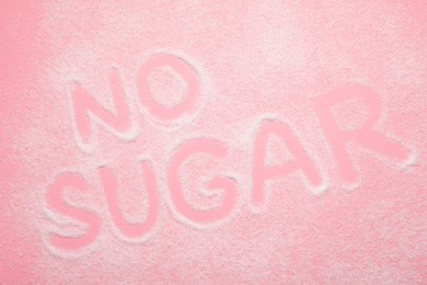 Photo of Words No Sugar on pink background, top view