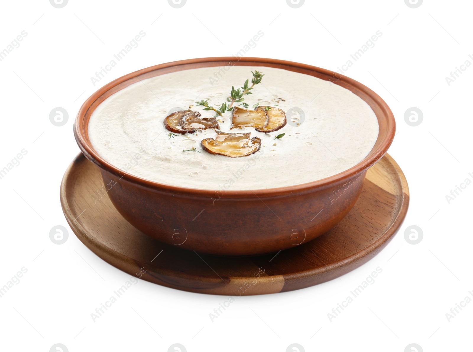 Photo of Fresh homemade mushroom soup in ceramic bowl isolated on white