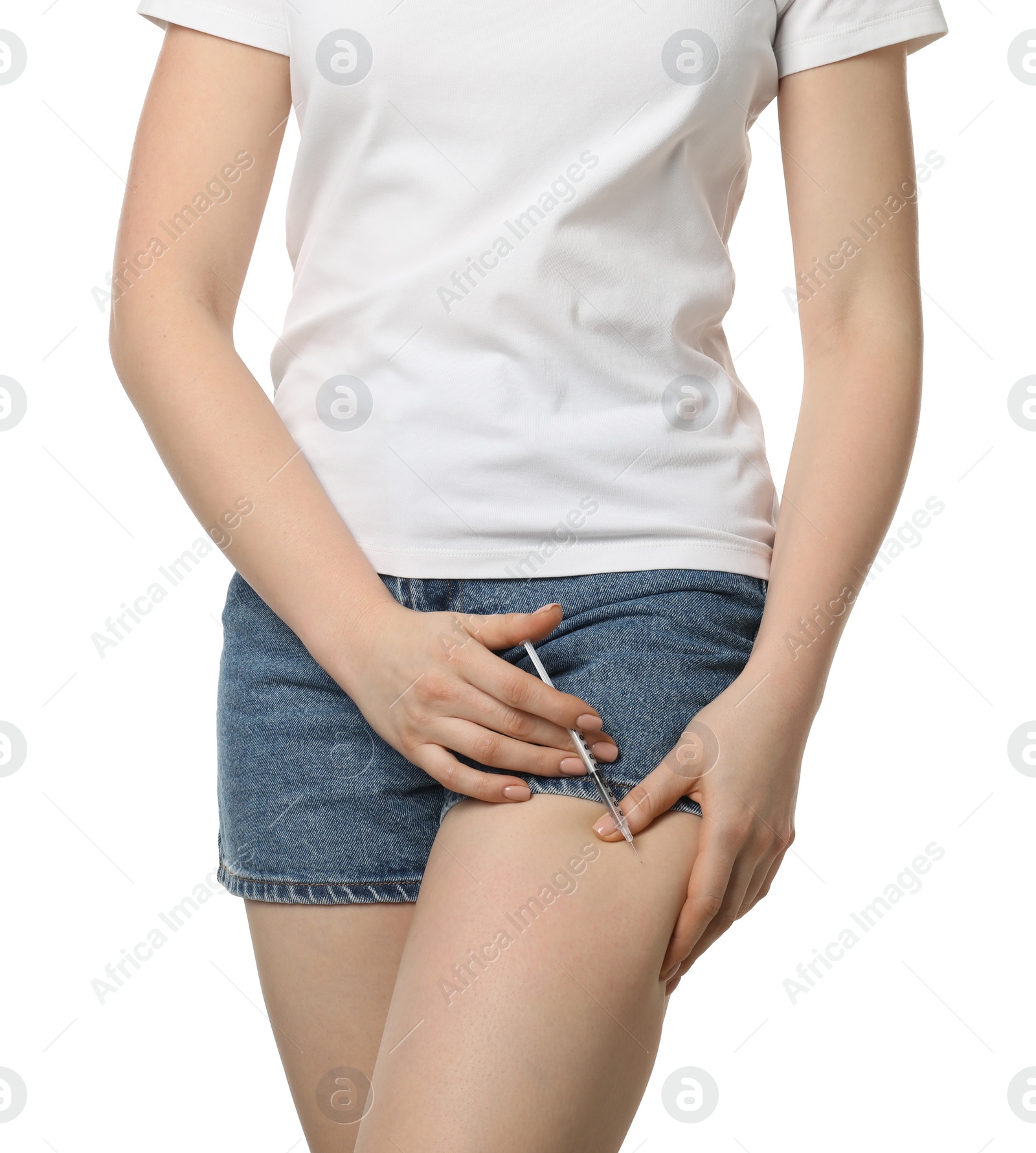 Photo of Diabetes. Woman making insulin injection into her leg on white background, closeup