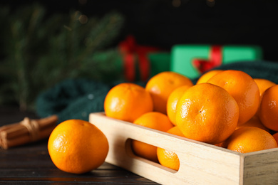 Tasty fresh tangerines on wooden table. Christmas celebration