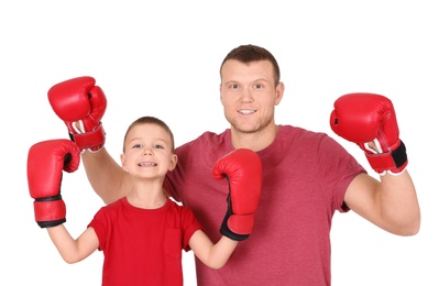 Photo of Happy dad and his son boxing on white background. Father's day celebration