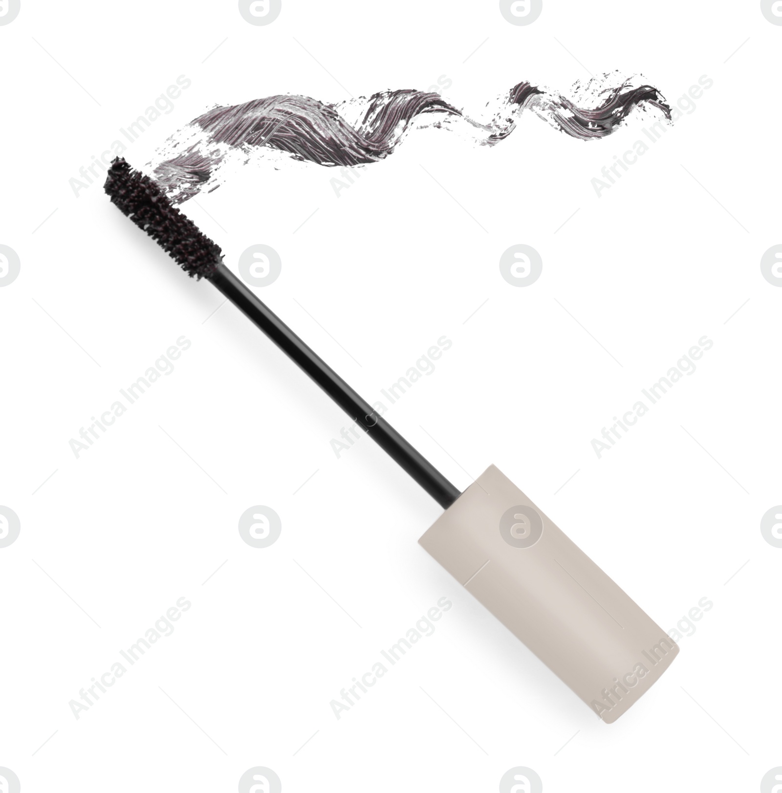 Photo of Applicator brush and brown mascara stroke on white background, top view