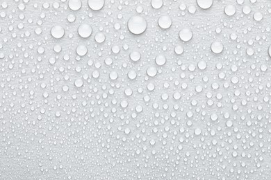 Image of Water drops on white background, top view