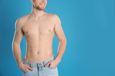 Man with slim body on color background, closeup. Space for text