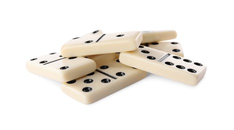 Photo of Pile of classic domino tiles on white background