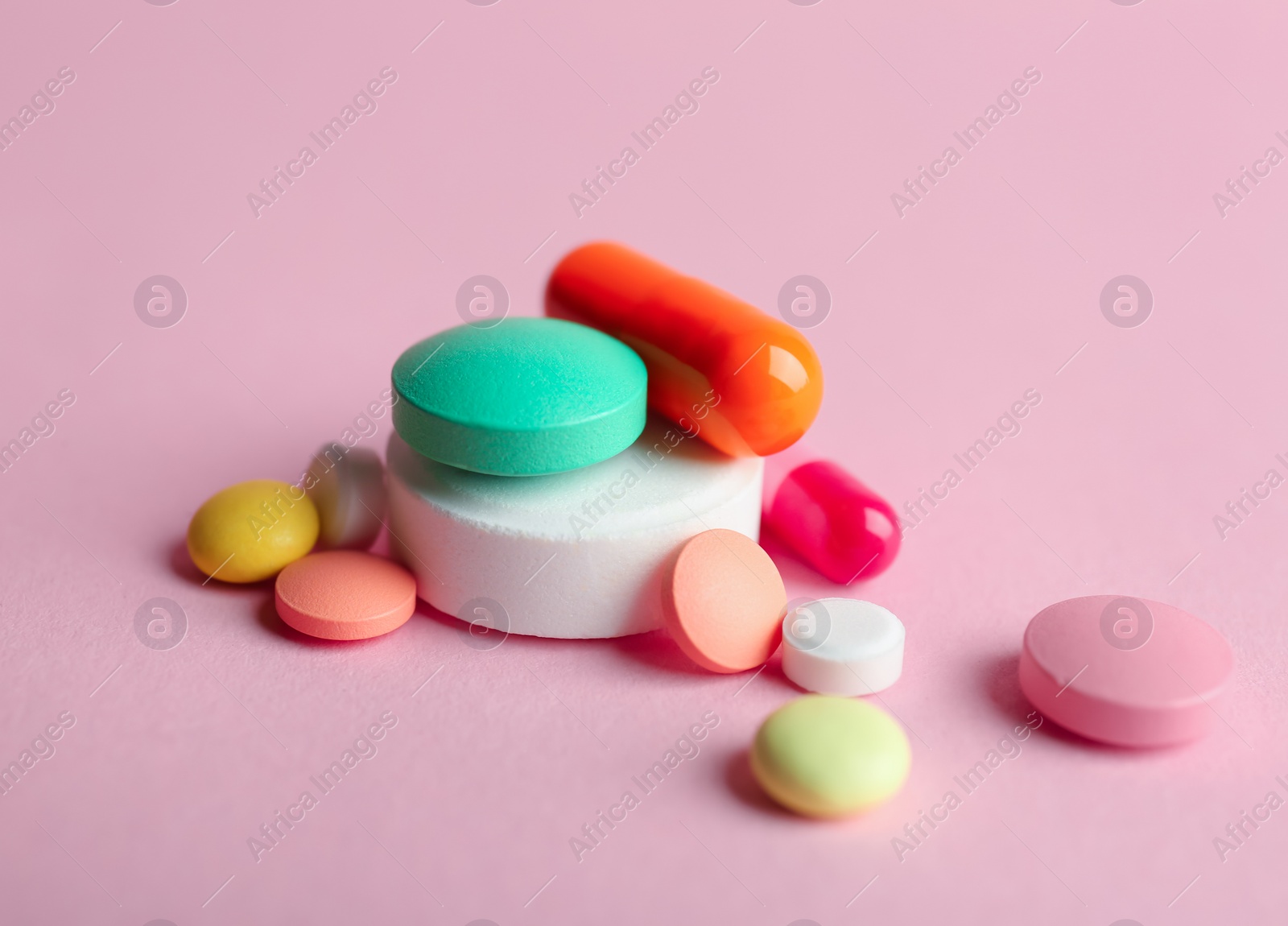 Photo of Different pills on color background