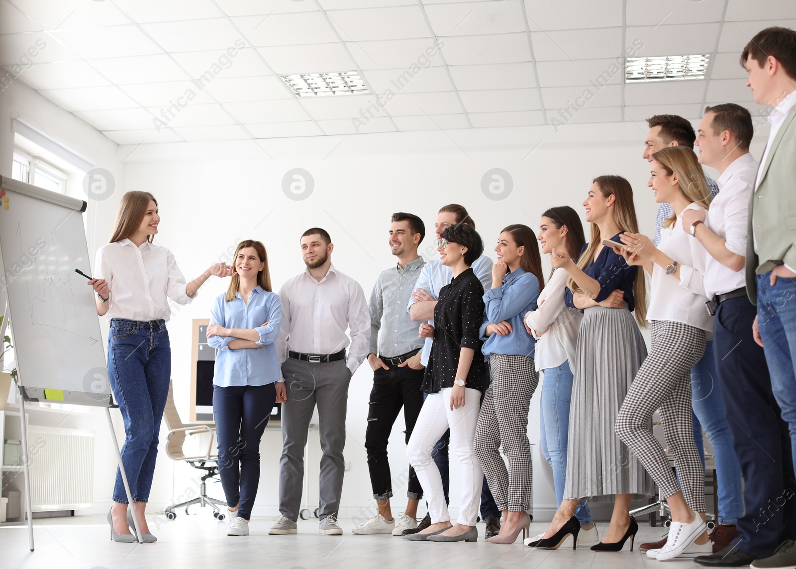 Photo of Female business trainer giving lecture in office