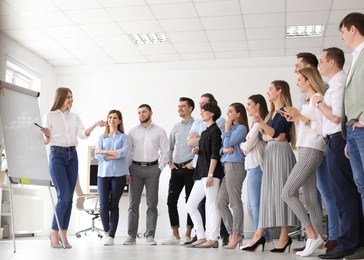 Female business trainer giving lecture in office