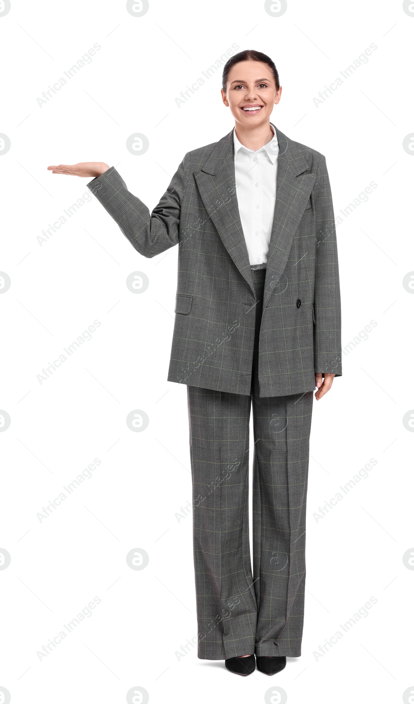 Photo of Beautiful businesswoman in suit pointing at something on white background