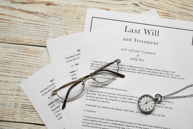 Photo of Last Will and Testament, glasses and pocket watch on white wooden table, top view
