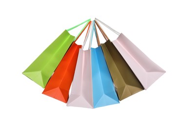 Photo of Colorful paper shopping bags isolated on white