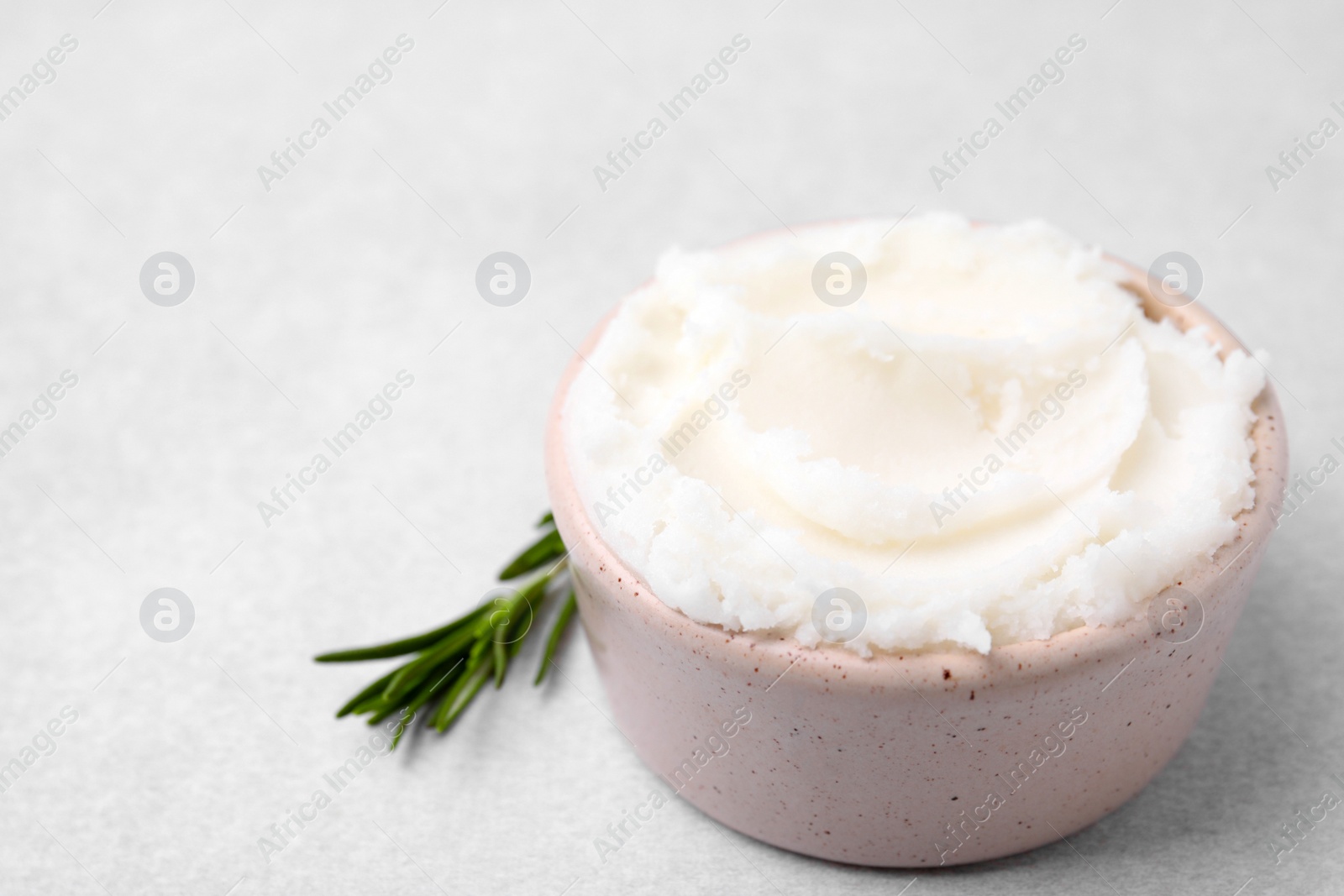 Photo of Delicious pork lard in bowl on light table, space for text