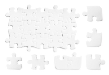 Set with jigsaw puzzle pieces on white background, top view