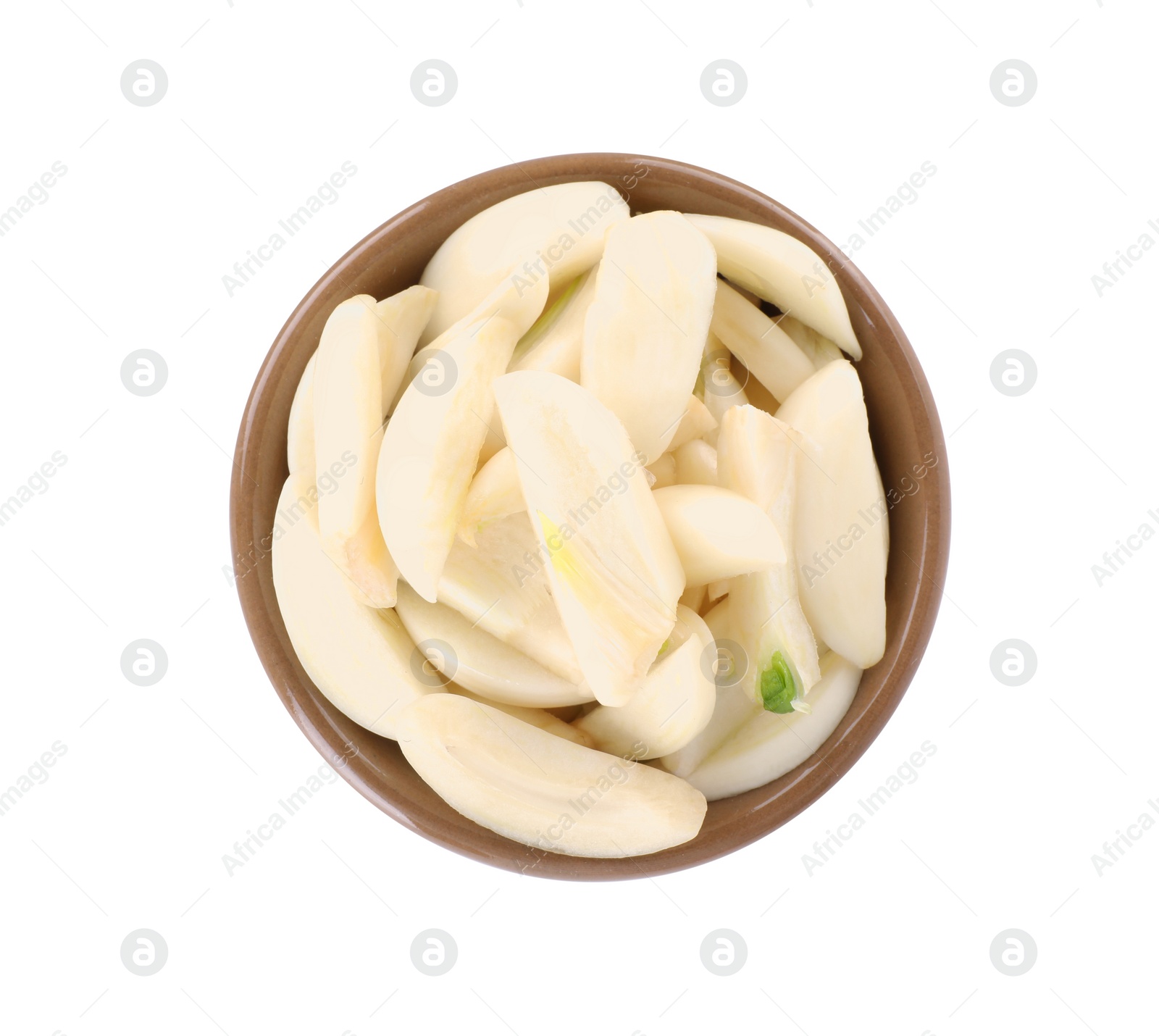 Photo of Peeled cloves of fresh garlic in bowl isolated on white, top view