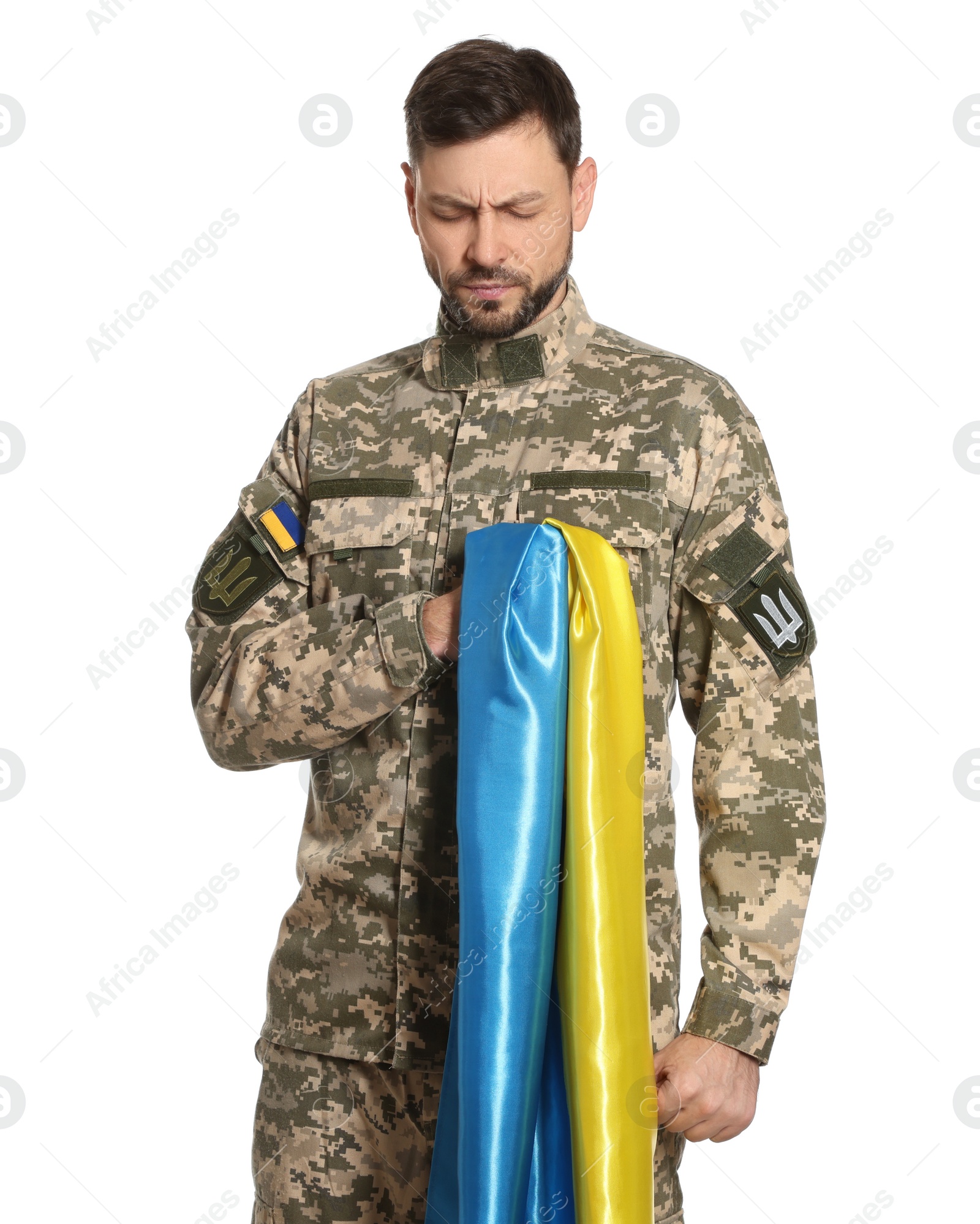 Photo of Soldier in military uniform with Ukrainian flag on white background