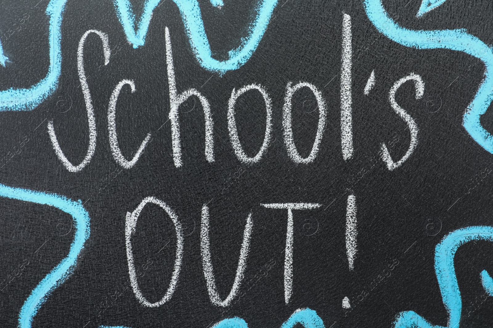 Photo of Text School's Out written on black chalkboard. Summer holidays