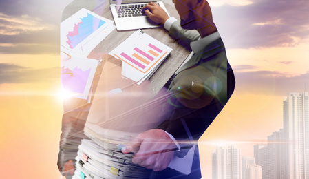 Multiple exposure of businessmen, documents and cityscape, closeup