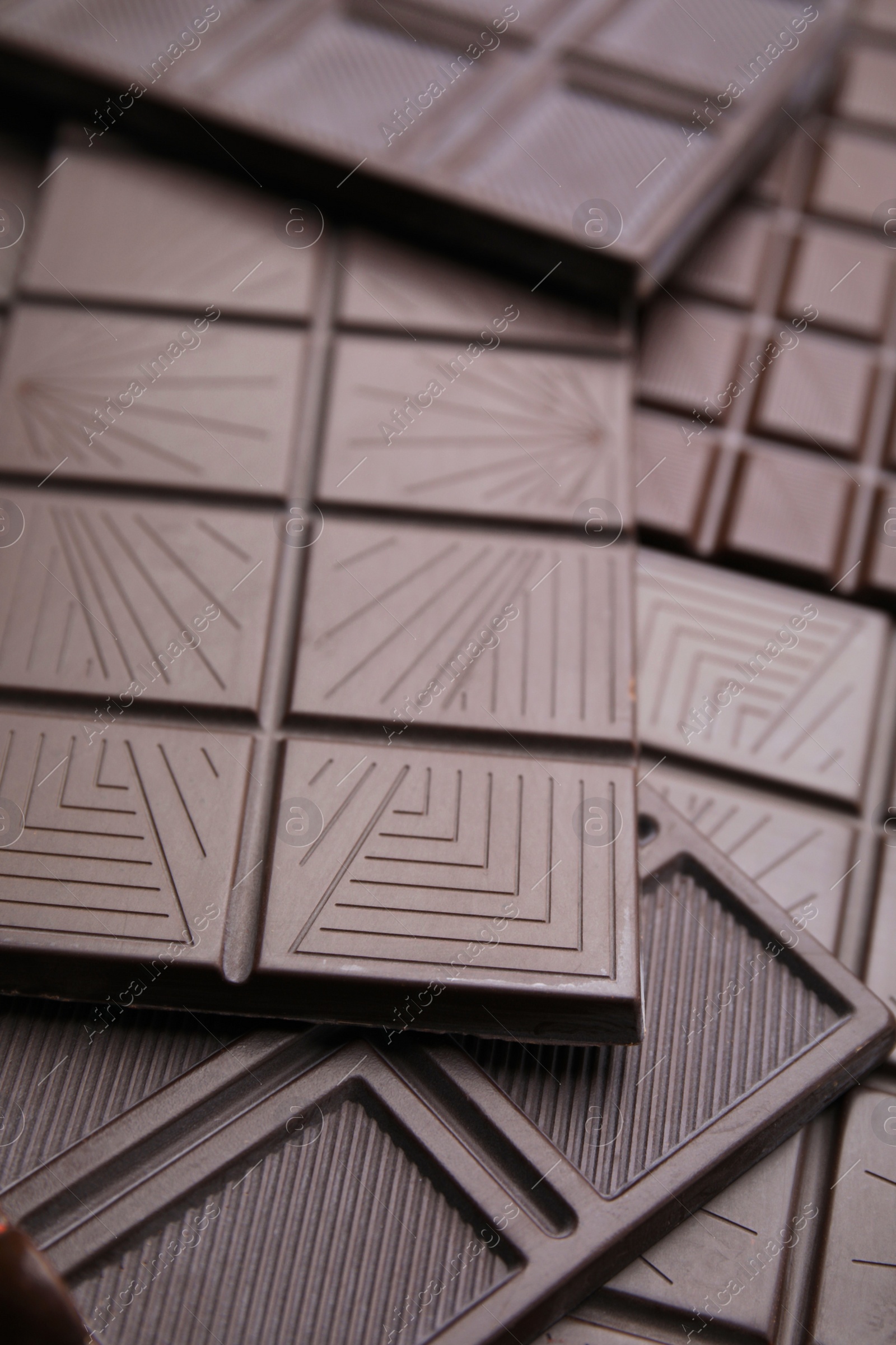 Photo of Many tasty chocolate bars as background, closeup