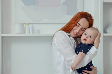 Photo of Mother with her cute baby at home, space for text