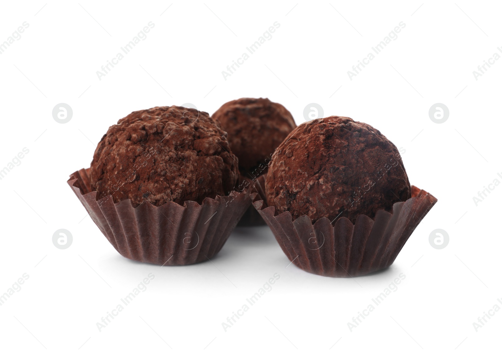 Photo of Delicious chocolate truffle candies isolated on white