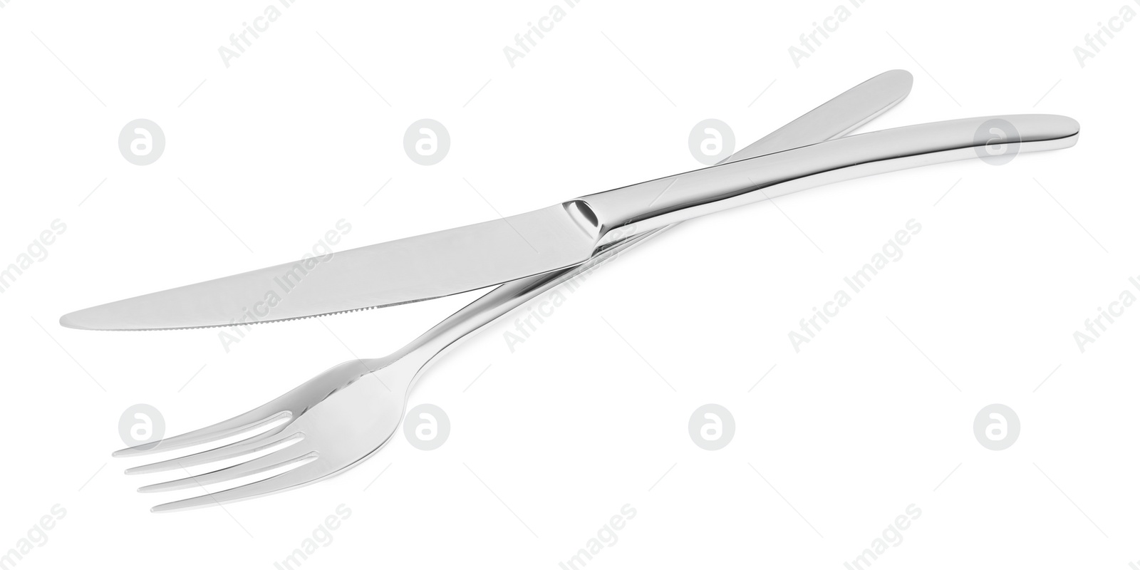 Photo of Fork and knife isolated on white. Stylish shiny cutlery set