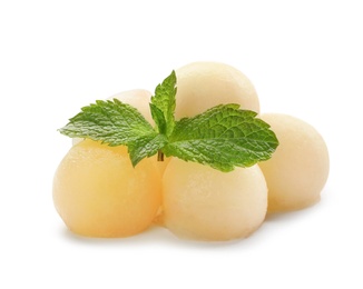 Photo of Melon balls and mint on white background