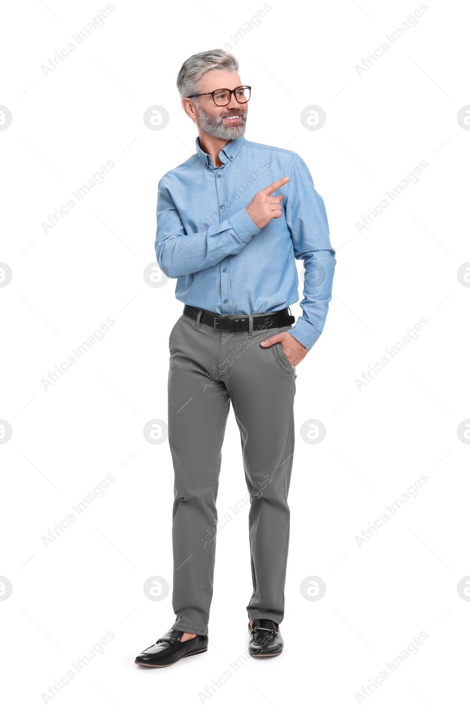 Photo of Mature businessman in stylish clothes posing on white background