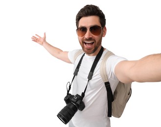 Smiling man with camera taking selfie on white background